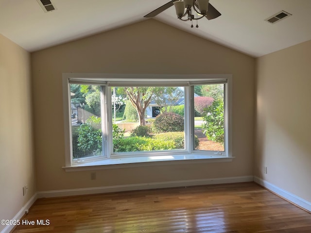 1905 Staunton Ct, Wilmington, NC 28405 - spare room with a ceiling fan, wood finished floors, and lofted ceiling