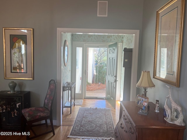 foyer featuring visible vents