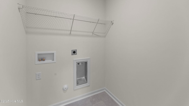 clothes washing area with baseboards, laundry area, electric dryer hookup, washer hookup, and hookup for a gas dryer