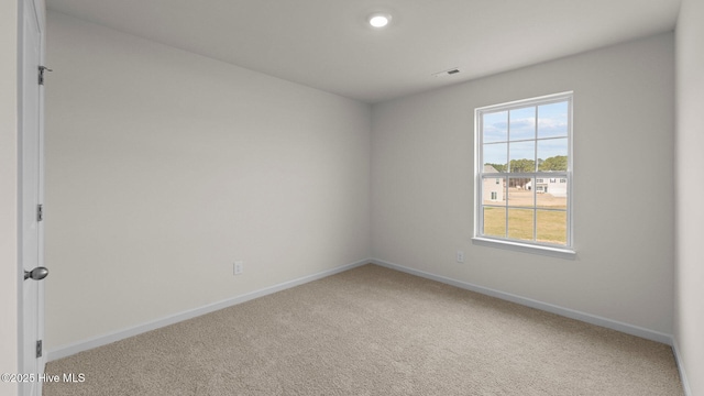 empty room with carpet flooring and baseboards