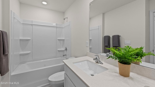 bathroom featuring toilet, vanity, and  shower combination