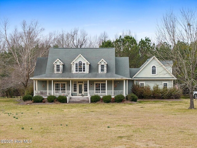 view of front of property with covered porch and a front lawn