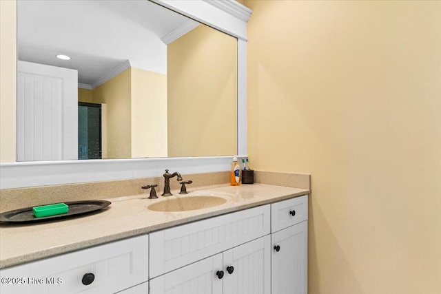 bathroom with vanity and ornamental molding