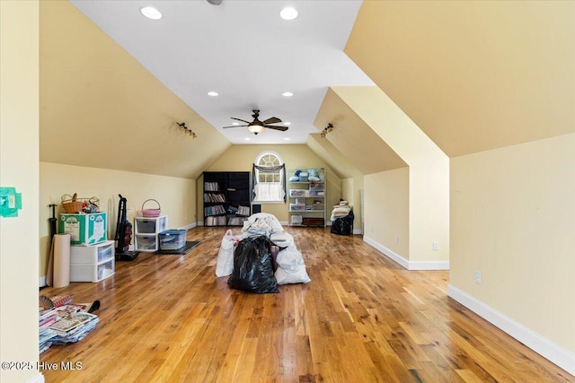 additional living space featuring recessed lighting, baseboards, wood finished floors, and vaulted ceiling