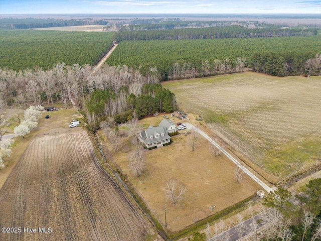 bird's eye view featuring a forest view and a rural view