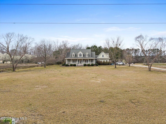 view of front of home with a porch and a front yard