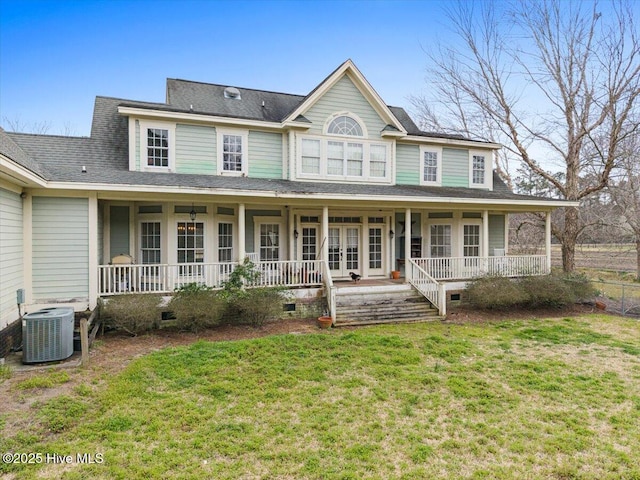 view of front of home with a front lawn, covered porch, cooling unit, french doors, and crawl space