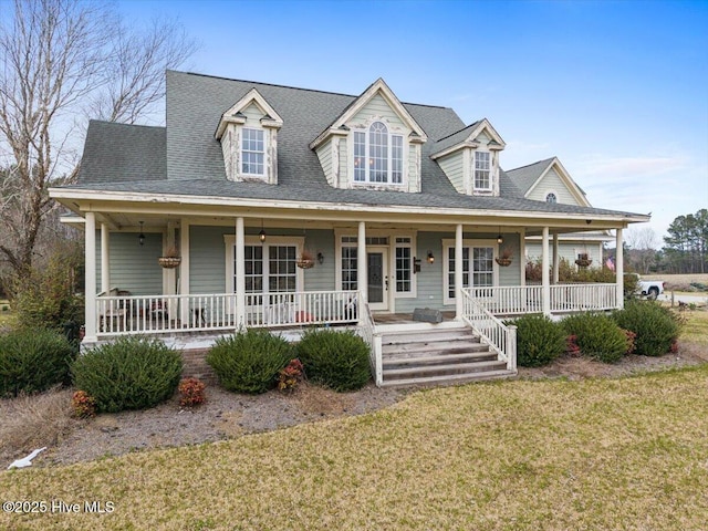 view of front of home with a porch and a front lawn