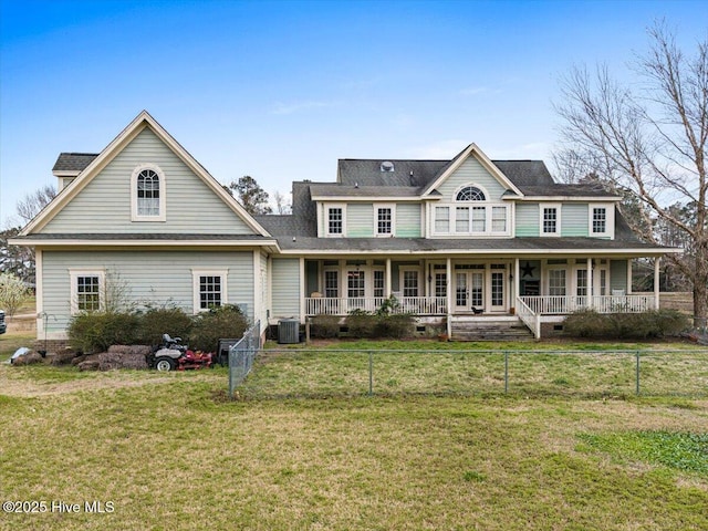 rear view of property with a fenced front yard, a porch, central AC unit, a lawn, and crawl space