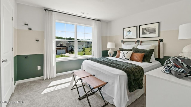 bedroom featuring visible vents, carpet floors, and baseboards