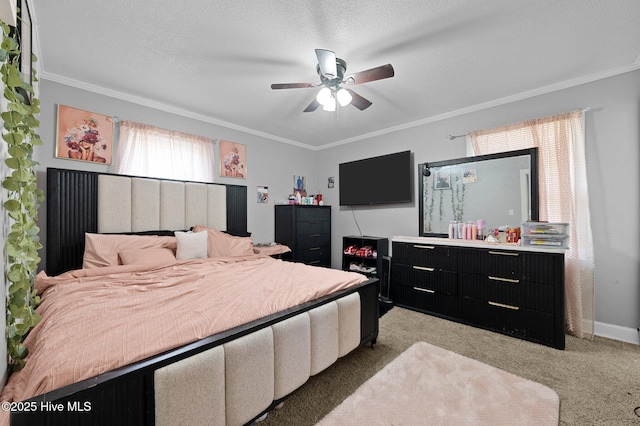 carpeted bedroom with a textured ceiling, ornamental molding, and a ceiling fan