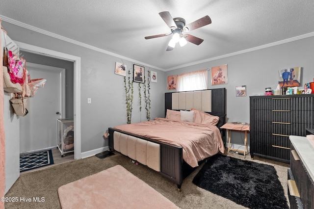 carpeted bedroom with ornamental molding, a ceiling fan, baseboards, and a textured ceiling