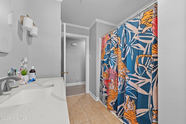 full bath featuring ornamental molding, a sink, curtained shower, tile patterned flooring, and baseboards