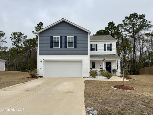 traditional-style home featuring covered porch, an attached garage, and concrete driveway