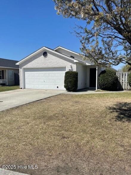 7223 Konlack Ct, Wilmington, NC 28411 - view of front of home with a front yard, driveway, and an attached garage