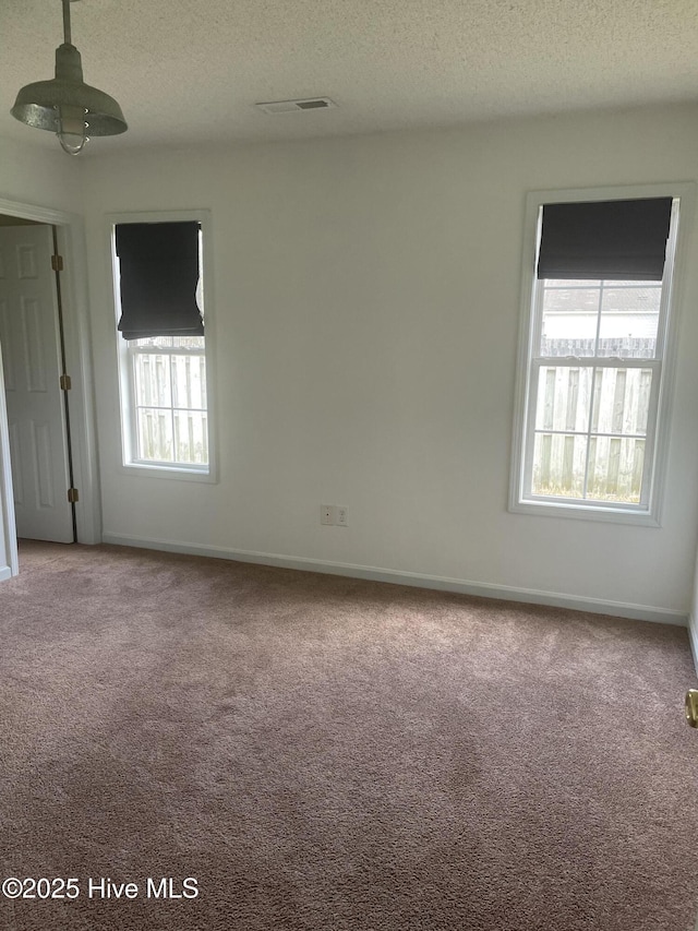 7223 Konlack Ct, Wilmington, NC 28411 - unfurnished room featuring a textured ceiling, visible vents, and carpet