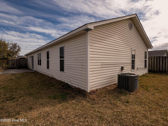 7223 Konlack Ct, Wilmington, NC 28411 - view of home's exterior featuring a yard, central air condition unit, and fence