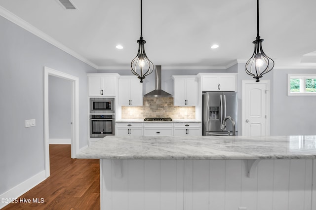 1115 Eldora Ct, Leland, NC 28451 - kitchen featuring wall chimney range hood, stainless steel appliances, baseboards, white cabinets, and ornamental molding