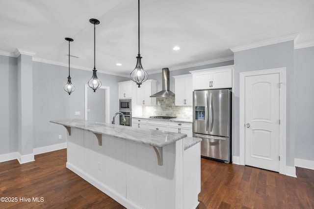 1115 Eldora Ct, Leland, NC 28451 - kitchen featuring appliances with stainless steel finishes, wall chimney range hood, a breakfast bar area, baseboards, and crown molding