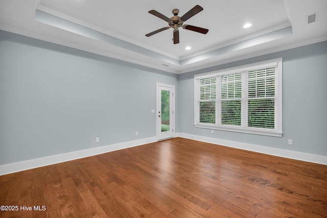 1115 Eldora Ct, Leland, NC 28451 - unfurnished room with a tray ceiling, crown molding, ceiling fan, wood finished floors, and baseboards