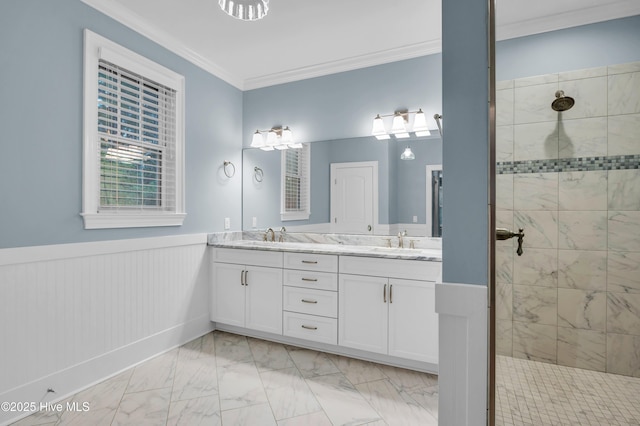 1115 Eldora Ct, Leland, NC 28451 - full bathroom featuring marble look tiles, double vanity, tiled shower, crown molding, and wainscoting
