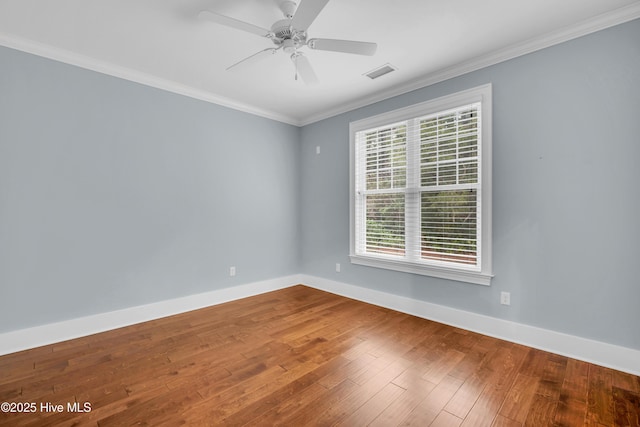 1115 Eldora Ct, Leland, NC 28451 - spare room with ornamental molding, baseboards, wood finished floors, and ceiling fan