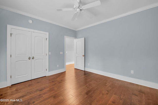 1115 Eldora Ct, Leland, NC 28451 - unfurnished bedroom featuring wood finished floors, ornamental molding, baseboards, a closet, and ceiling fan