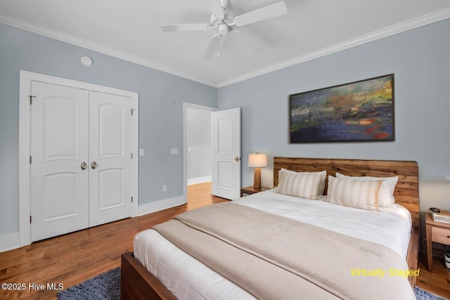 1115 Eldora Ct, Leland, NC 28451 - bedroom featuring crown molding, wood finished floors, baseboards, a closet, and ceiling fan