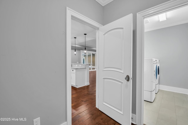1115 Eldora Ct, Leland, NC 28451 - laundry area with washing machine and clothes dryer, crown molding, and baseboards