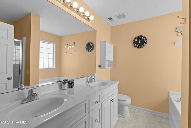 bathroom featuring toilet, baseboards, visible vents, and a sink