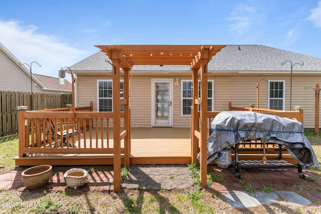 deck with fence, a pergola, and a grill