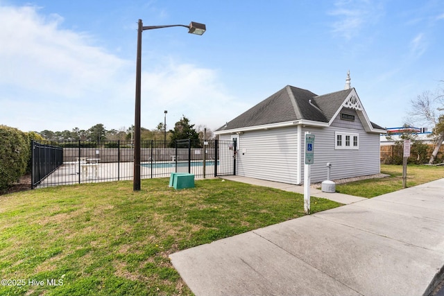 exterior space featuring a community pool and fence