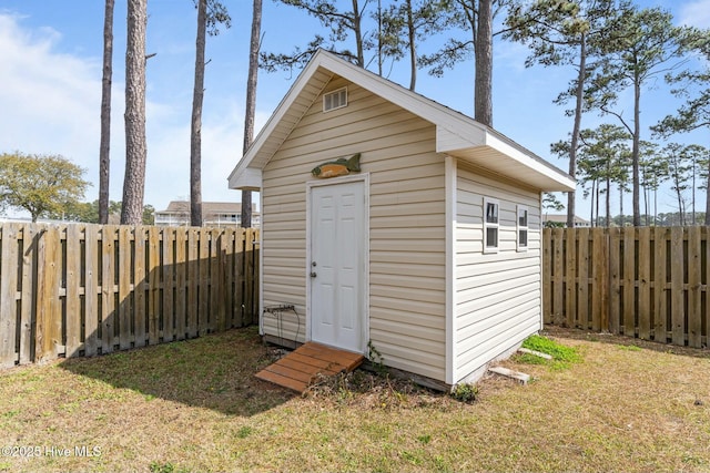 view of shed featuring a fenced backyard