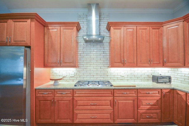 kitchen featuring ornamental molding, wall chimney exhaust hood, light stone countertops, and stainless steel appliances