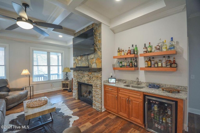 bar featuring dark wood-style floors, coffered ceiling, a sink, indoor wet bar, and wine cooler