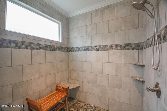 full bath featuring tiled shower and ornamental molding