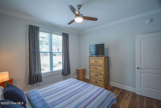 bedroom with baseboards, a ceiling fan, wood finished floors, and crown molding