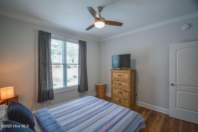 bedroom with crown molding, wood finished floors, baseboards, and ceiling fan