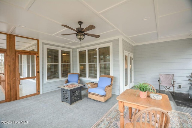 sunroom featuring a ceiling fan