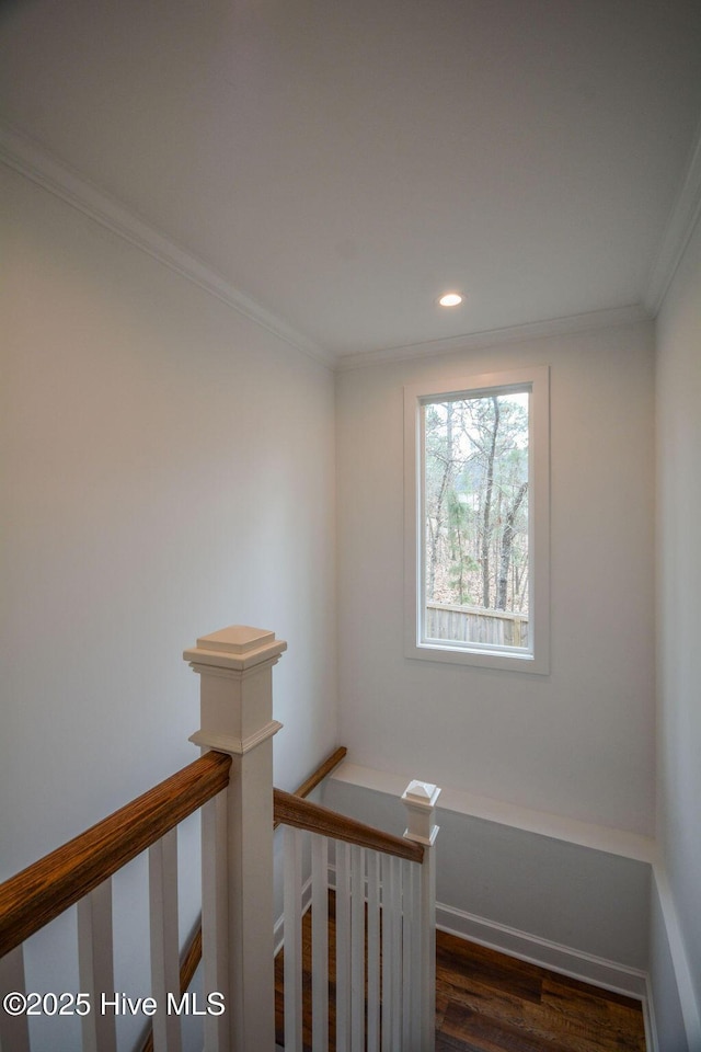 stairway featuring recessed lighting, wood finished floors, and crown molding