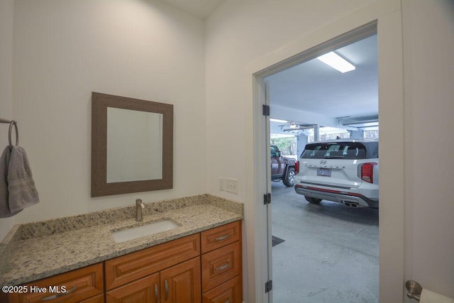 bathroom featuring concrete floors and vanity