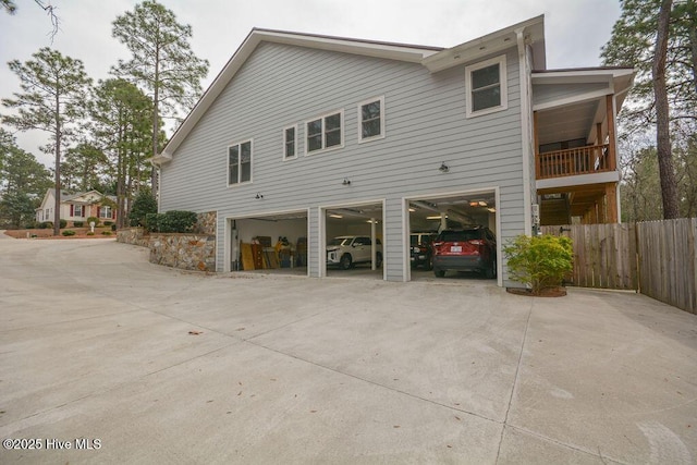 view of side of property with a garage and driveway