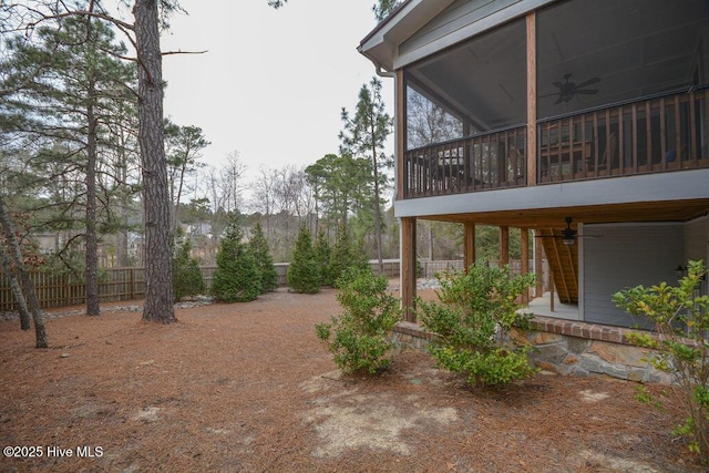 view of yard with a patio area, a ceiling fan, and fence