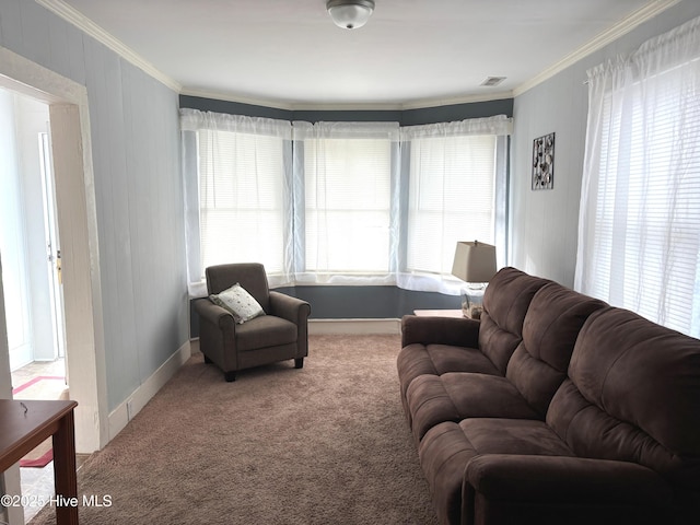 living room with visible vents, ornamental molding, and carpet flooring