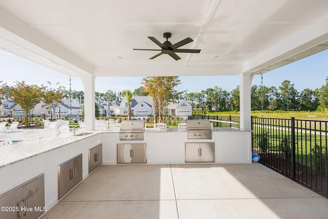 1514 Manta Ray Way, Sunset Beach, NC 28468 - view of patio / terrace featuring a ceiling fan, a sink, and a residential view