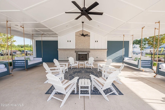 1514 Manta Ray Way, Sunset Beach, NC 28468 - view of patio / terrace featuring exterior fireplace and ceiling fan