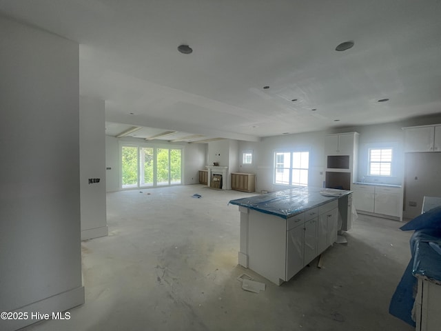 1514 Manta Ray Way, Sunset Beach, NC 28468 - kitchen with open floor plan, healthy amount of natural light, and white cabinets