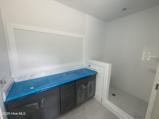 1514 Manta Ray Way, Sunset Beach, NC 28468 - bathroom with tiled shower and marble look tiles
