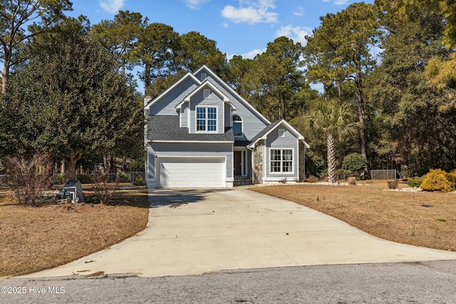 traditional-style house with concrete driveway and a garage