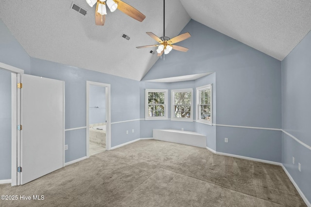 carpeted empty room with visible vents, baseboards, a textured ceiling, and a ceiling fan